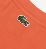 ⁦تيشرت  برتقالي مزين بشعار Lacoste⁩ - الصورة ⁦2⁩